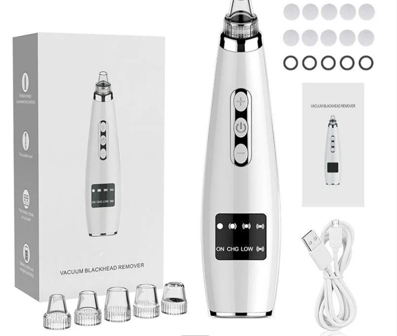 Vacuum blackhead remover with packaging, attachments, and USB cable on a white background